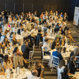 kirryn speaking in front of a large room
