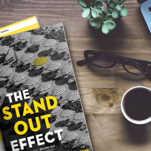 Copy Of The stand out effect on a wooden table with glasses and coffee