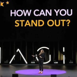 Kirryn stands on stage