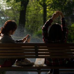 Two girls sitting on a bench