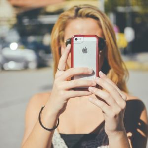 fashion girl taking a selfie photo - all you can see is the phone