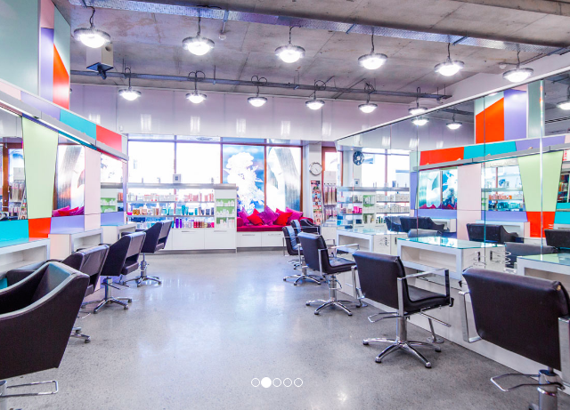 photo of the hair salon, chairs and coloured lights.