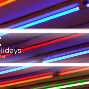 photo of neon lights with words hustle for the holidays